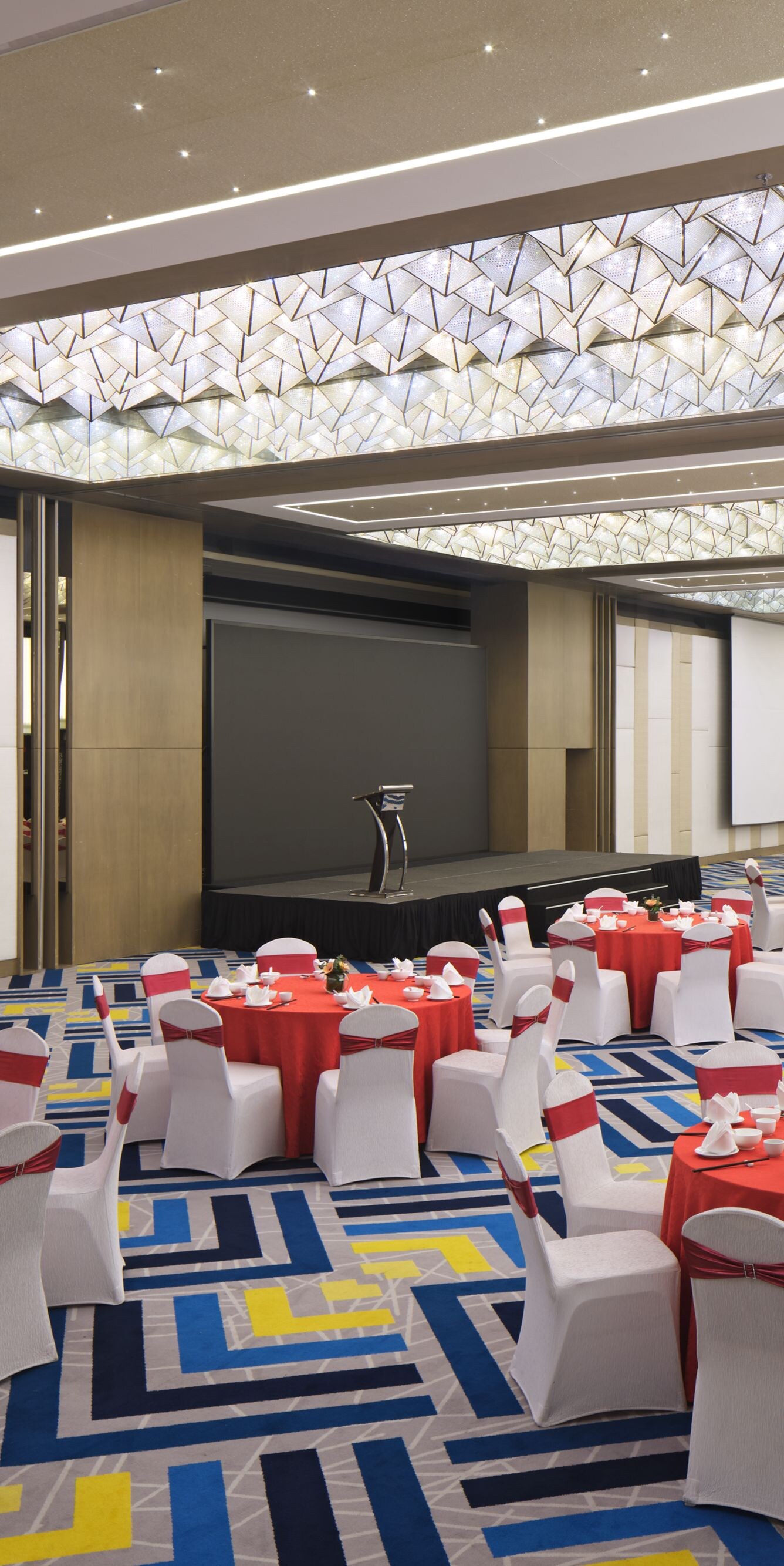 Ballroom with banquet setup and stage