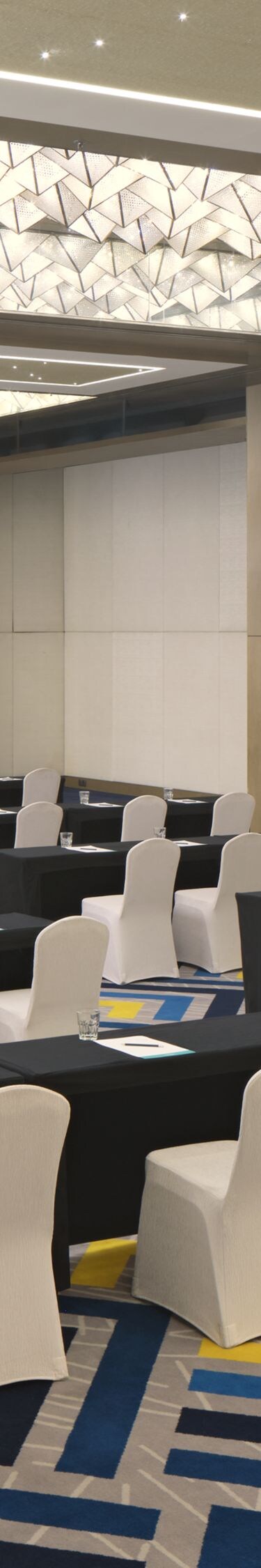 Ballroom with classroom setup and lighting