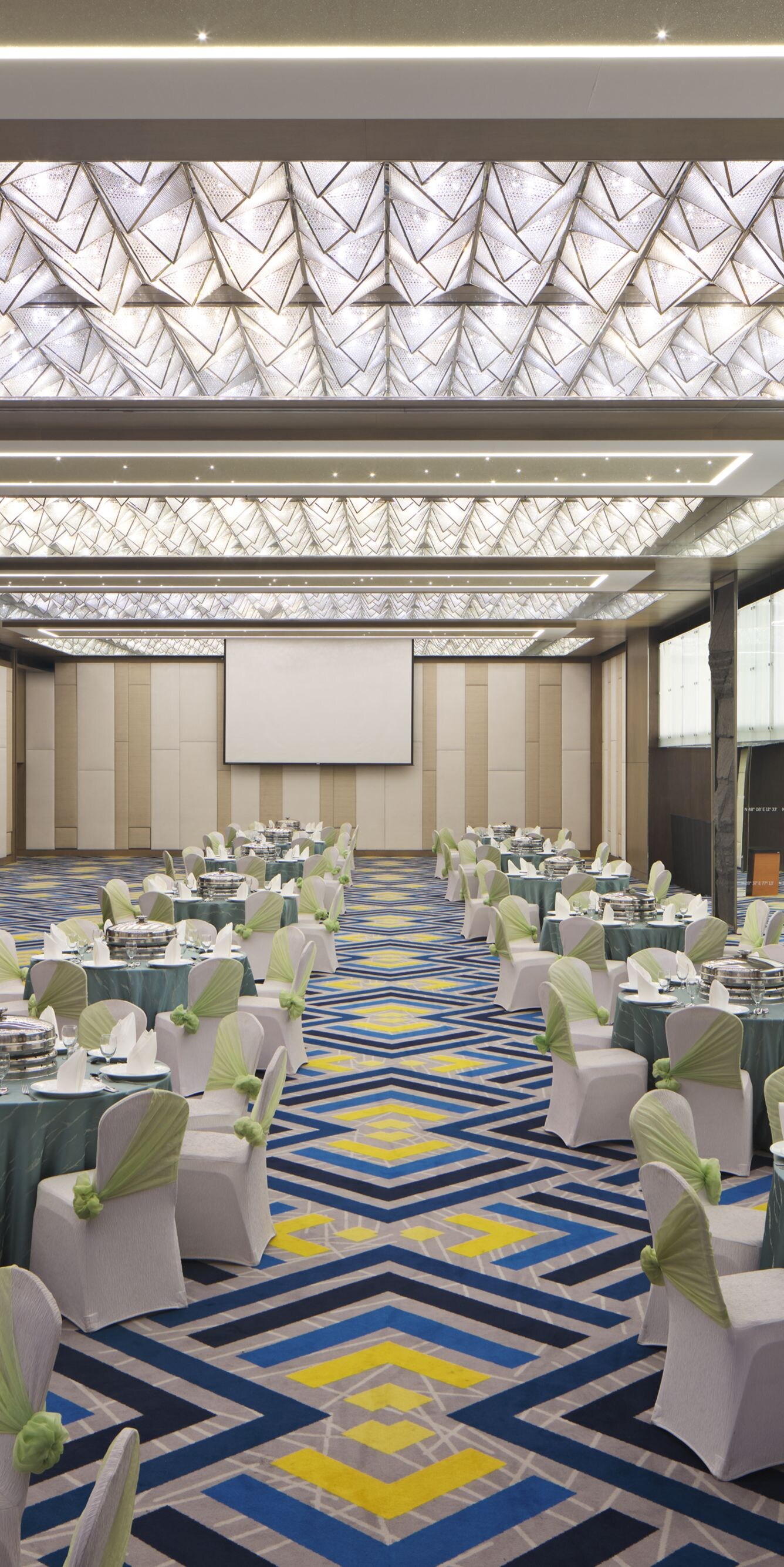 Ballroom with banquet setup and lighting