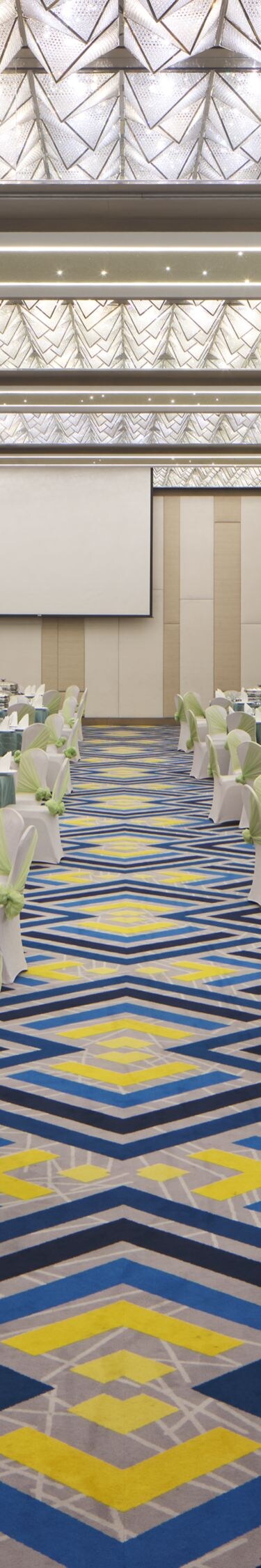 Ballroom with banquet setup and lighting