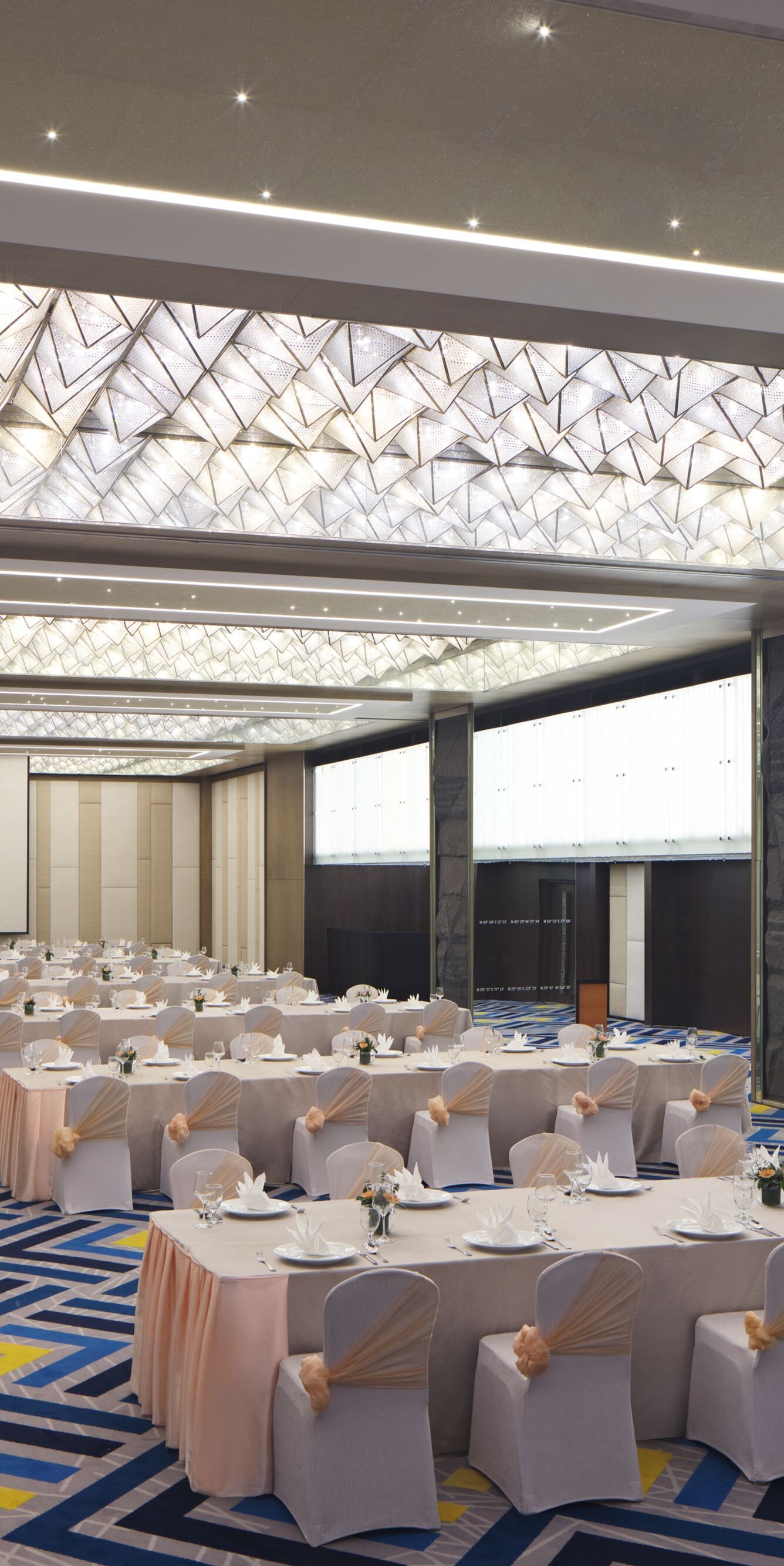 Ballroom with banquet setup and lighting