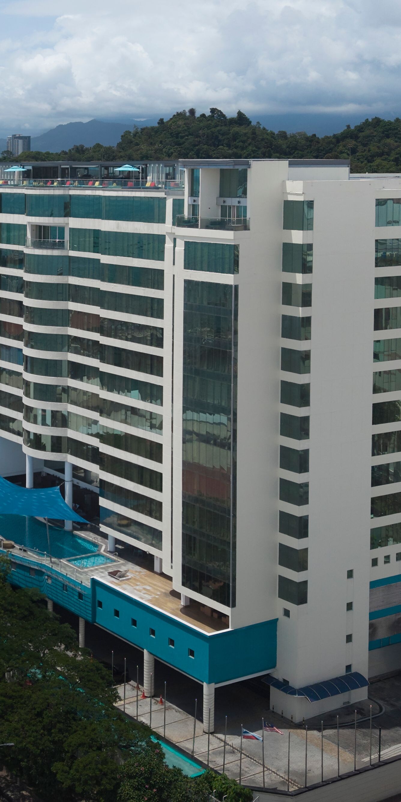 Aerial view of building with rooftop pool