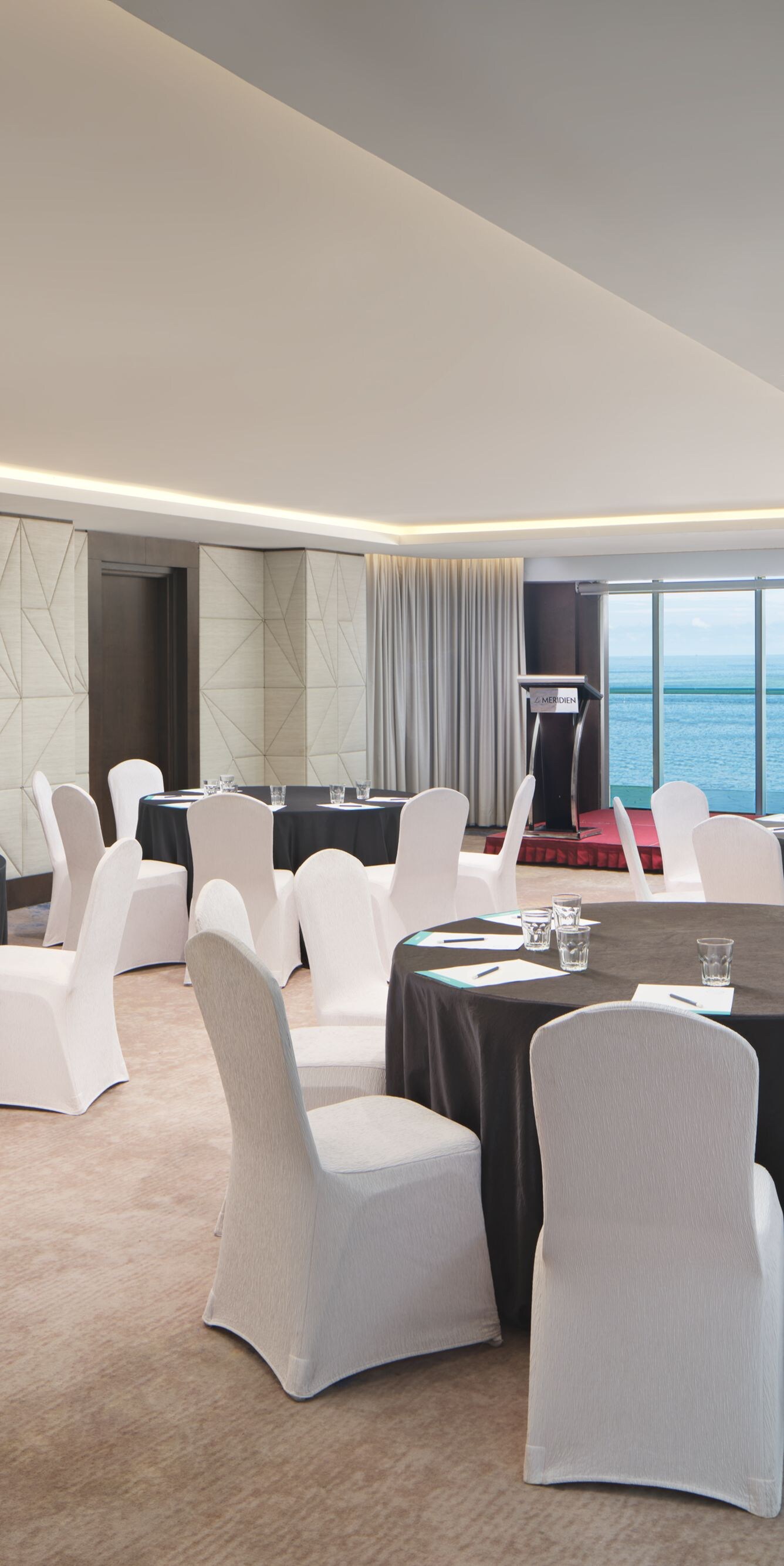 Meeting room with sea views and banquet setup