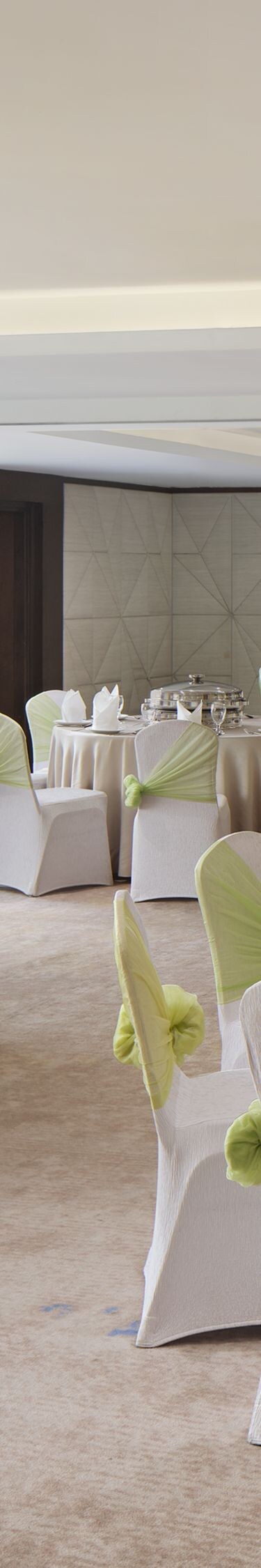 Ballroom with banquet setup and sea views