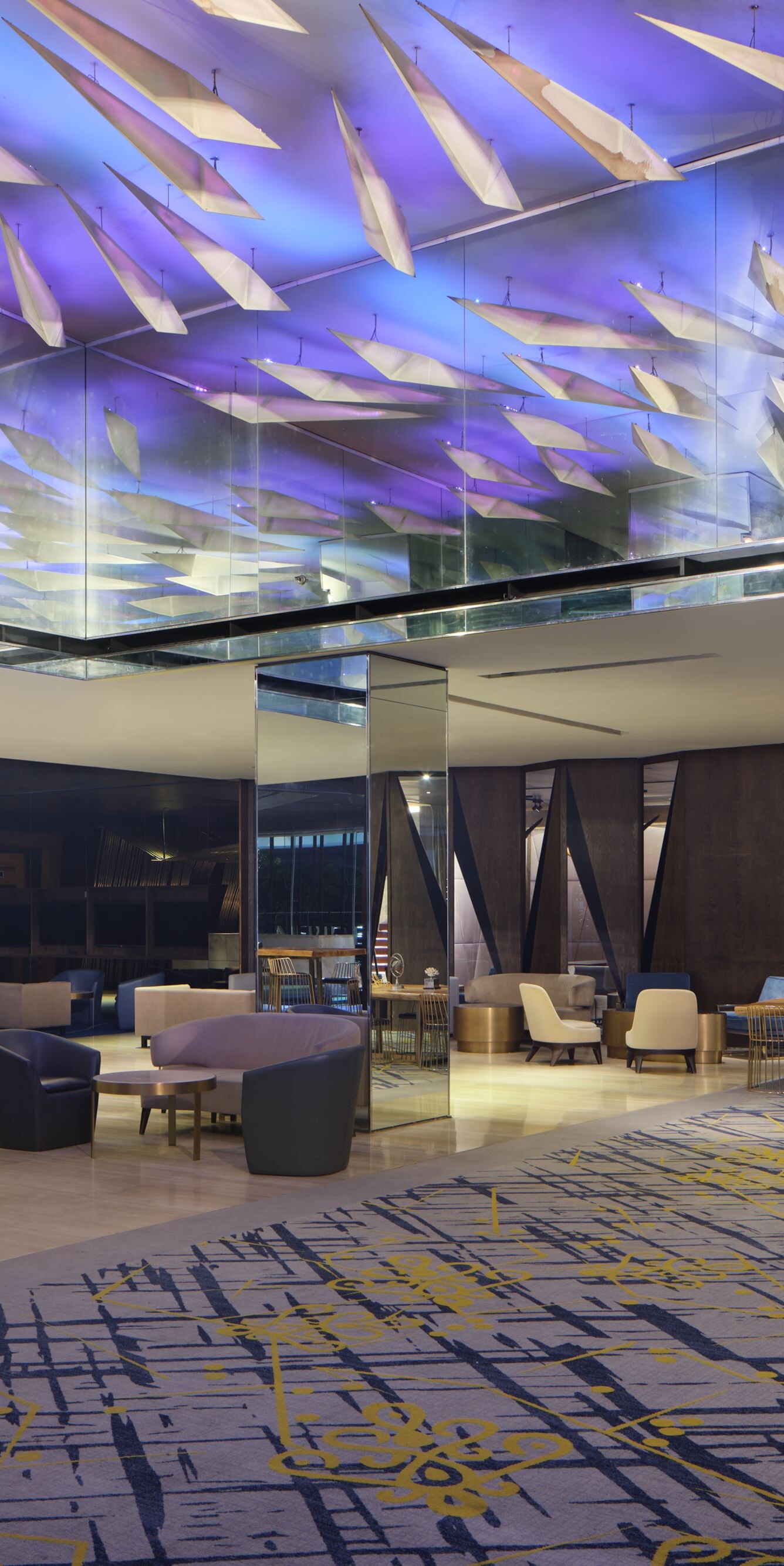 Lobby with sculptural ceiling and lighting