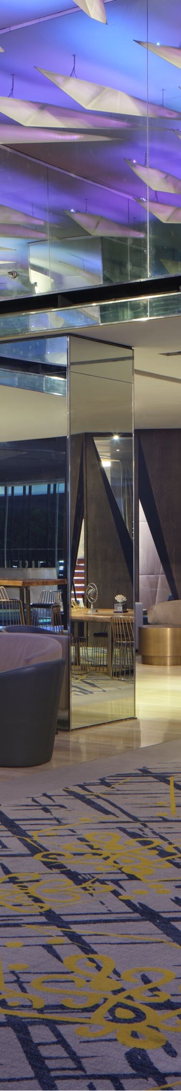 Lobby with sculptural ceiling and lighting