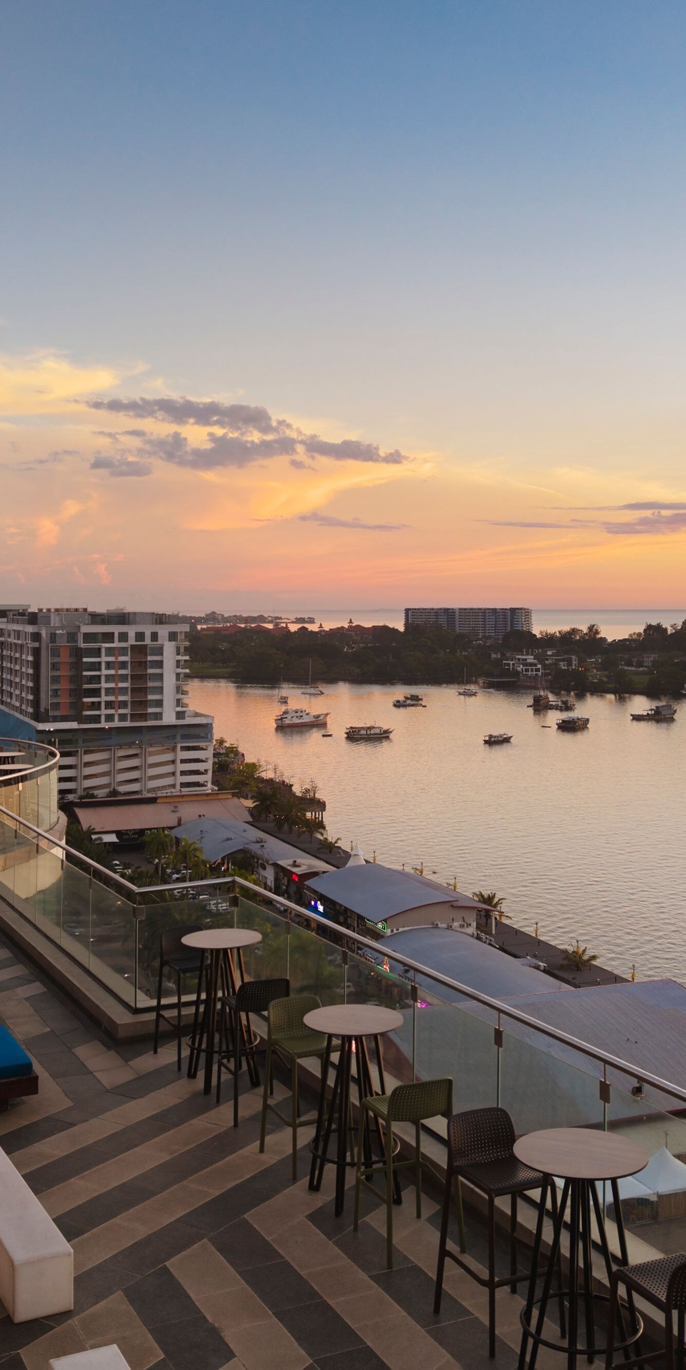 Rooftop bar with waterfront sunset view