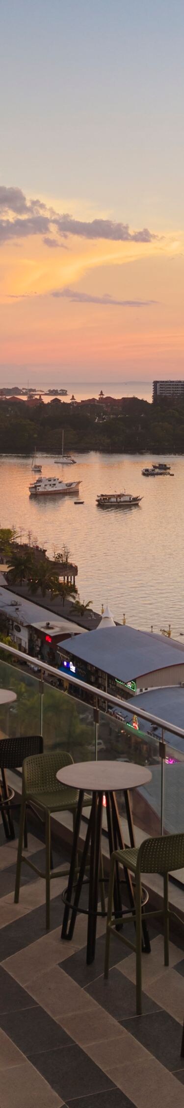 Rooftop bar with waterfront sunset view