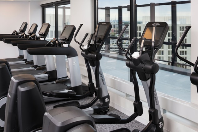 Ellipticals and treadmills in fitness center
