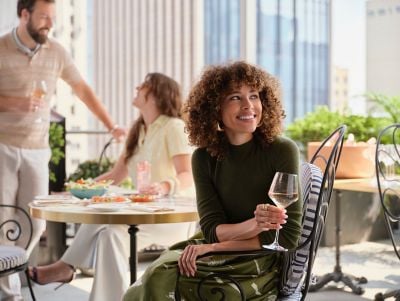 Three friends in the lounge sipping Rose wine