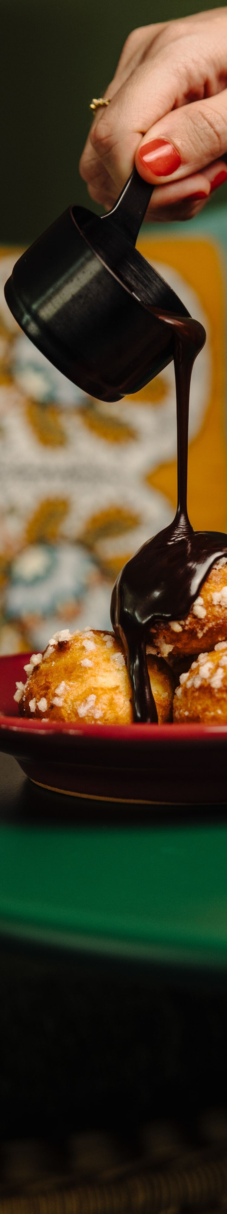 Chocolate sauce over dessert bites