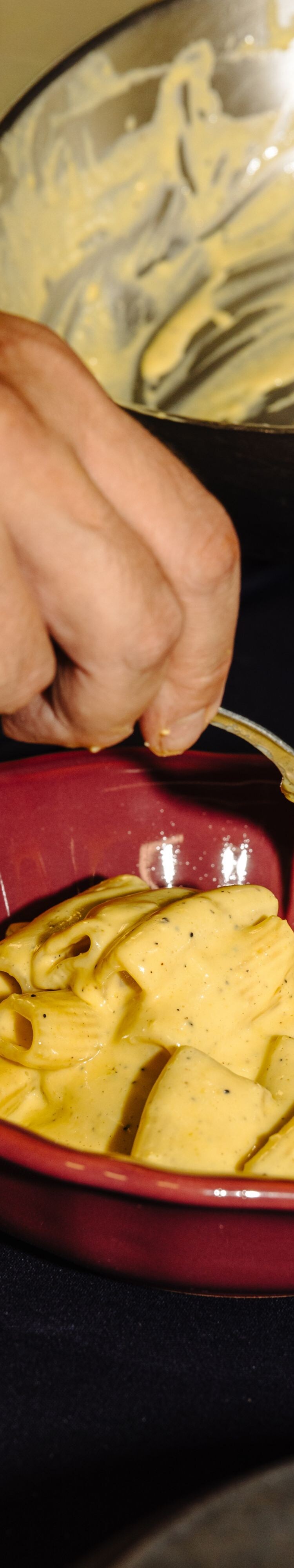 Creamy pasta being plated