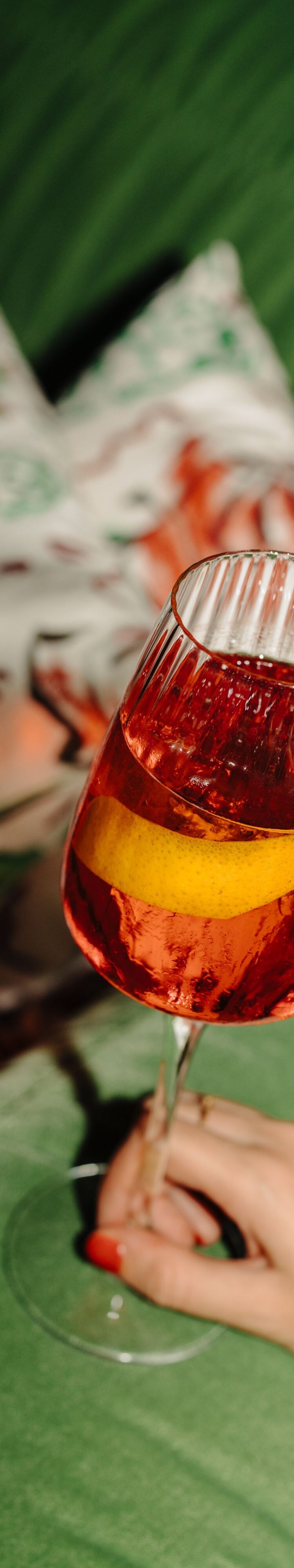Spritz cocktail on green sofa