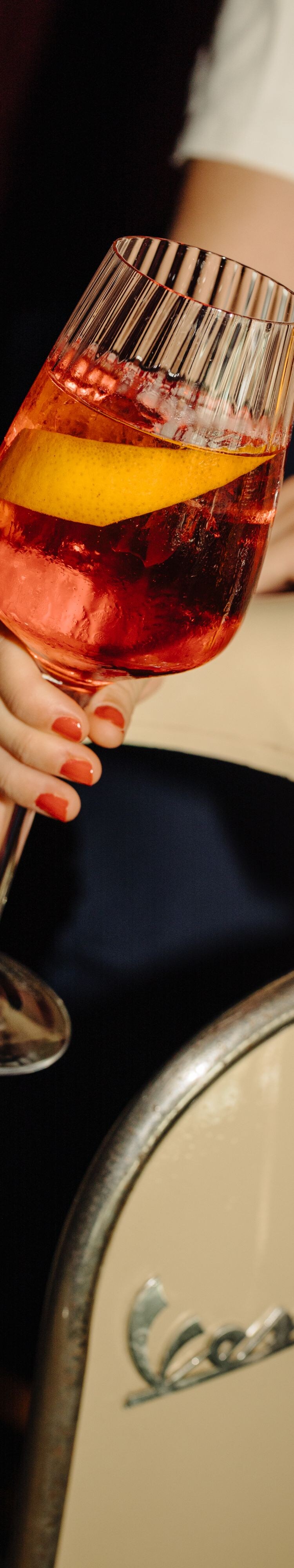 Spritz cocktail beside vintage Vespa