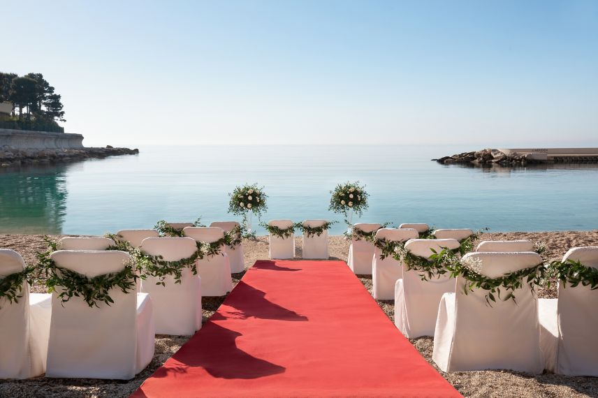 Wedding set up on the beach with a red carpet