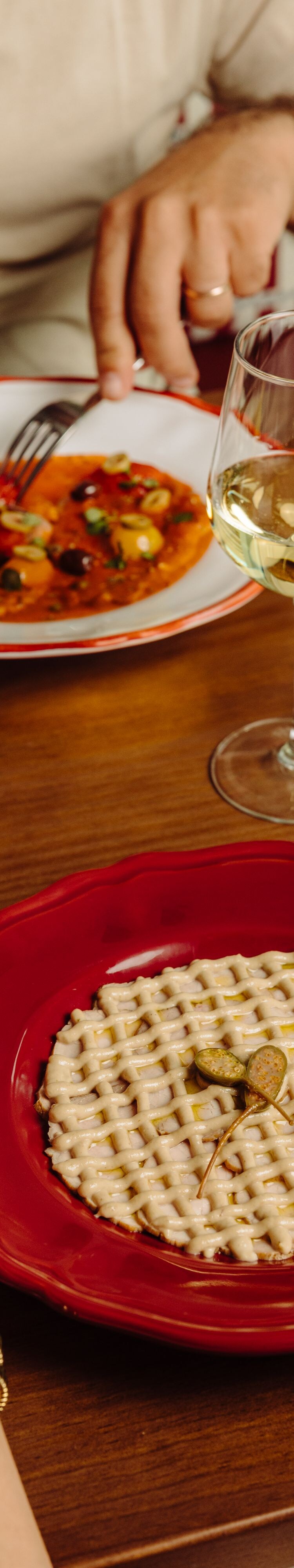 Guests sharing dishes at table