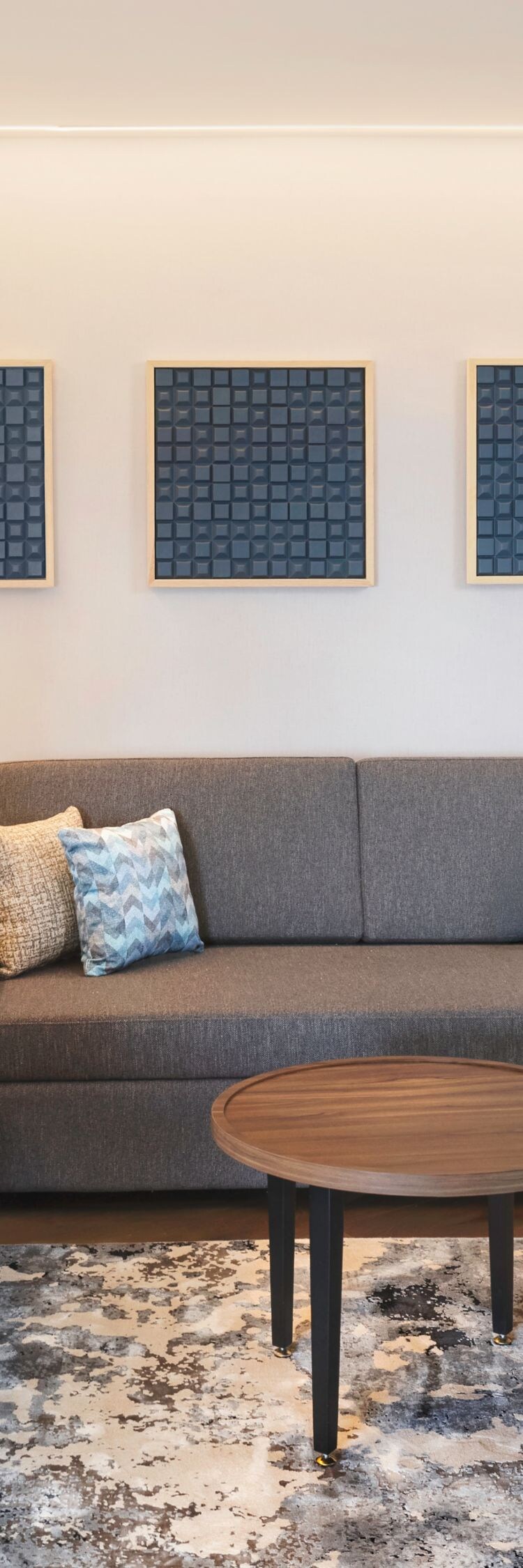 Modern living area with sofa and coffee tables