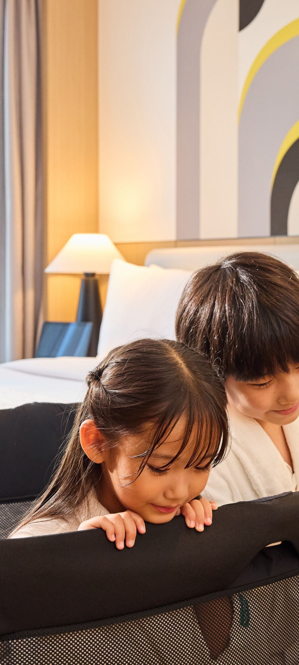 Kids’ bed guard in hotel guest room