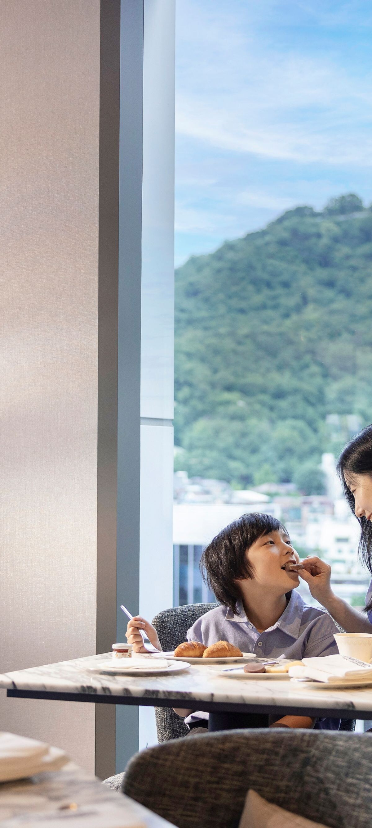 Mother and child dining with Namsan view