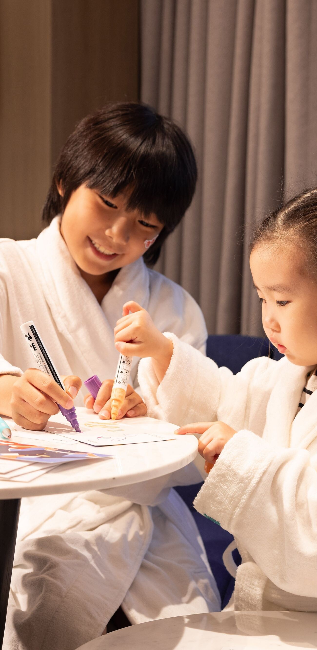 Children creating artwork together