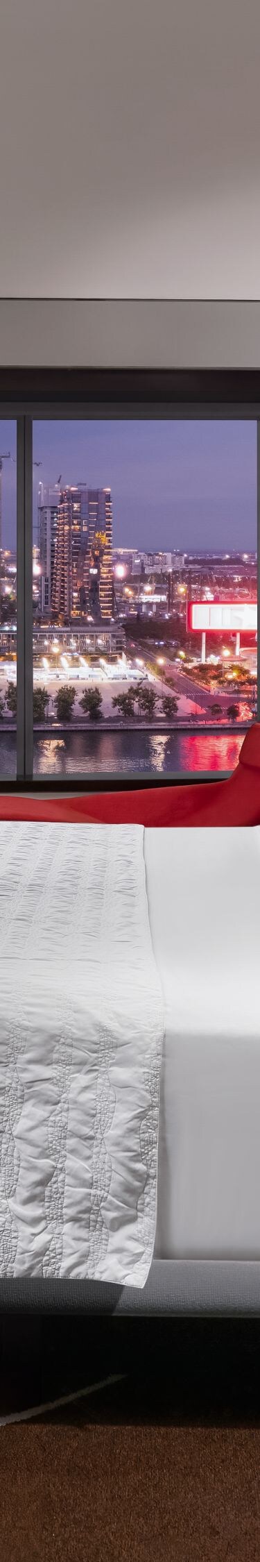 Spacious Premier Classic room at night with views