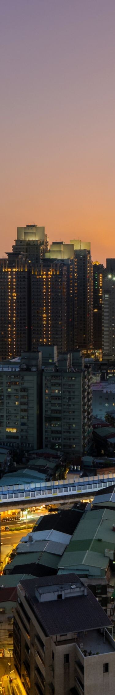 Exterior of hotel in city, night