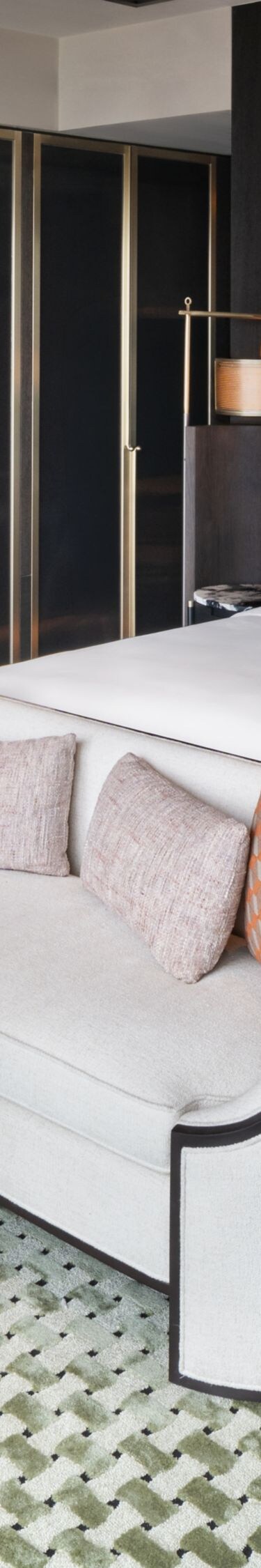 king bed, couch, table, armchair, and lamps