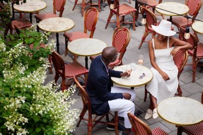 Couple drinking beverages at a café