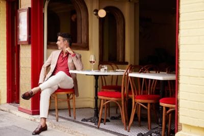 Man drinking beverage at a café