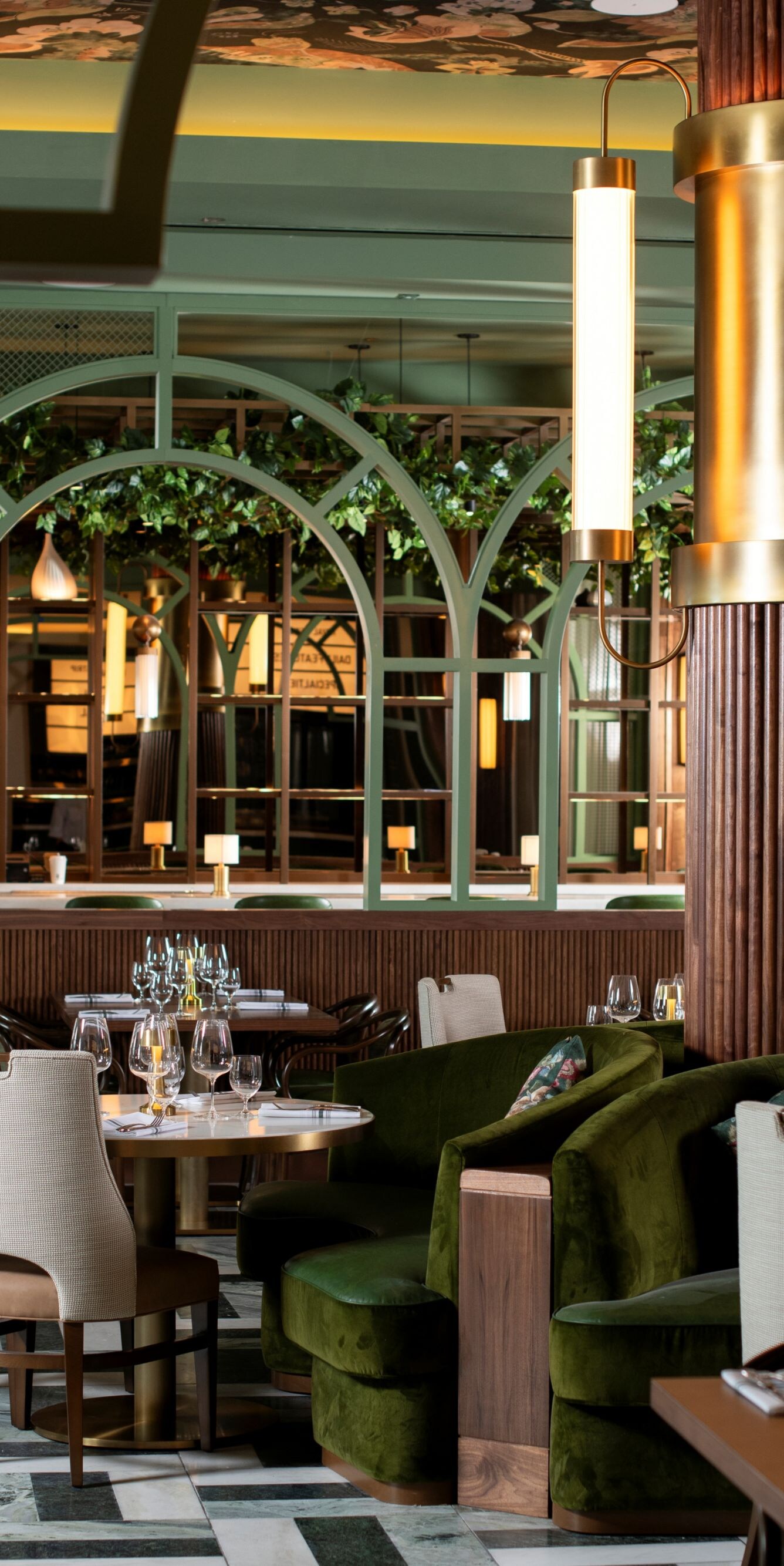 Chairs, tables, light fixture, white drapes.