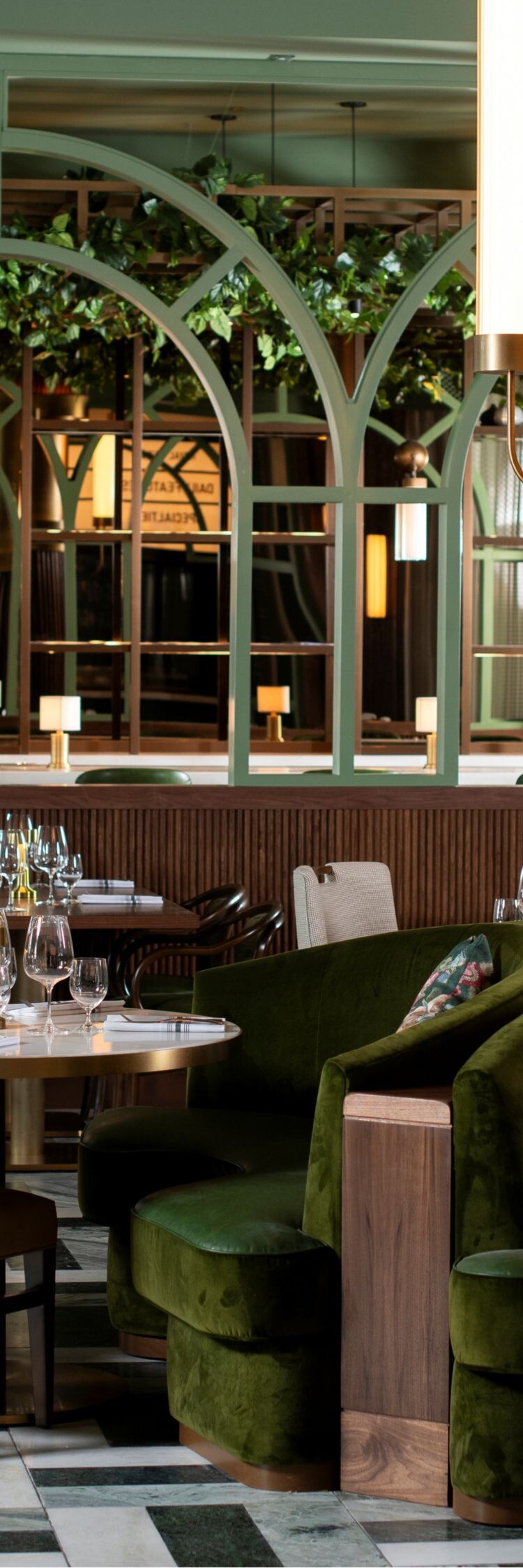 Chairs, tables, light fixture, white drapes.