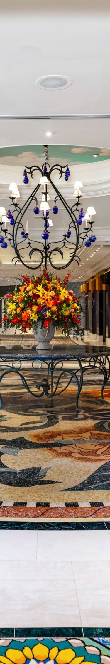Promenade, retail stores, planters, colored tile.