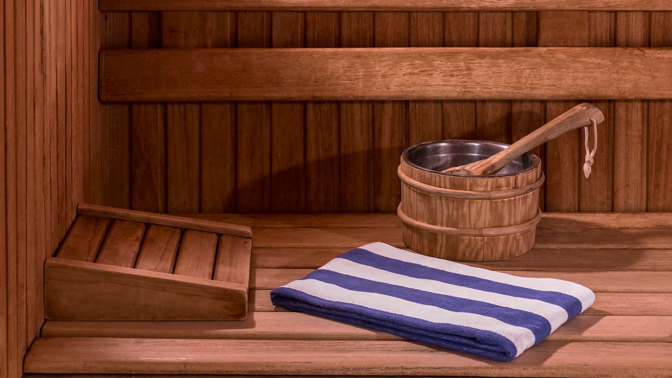 Steam room with towel and water bucket