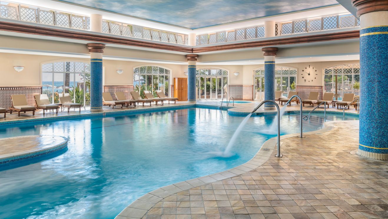 Indoor pool and whirlpool spa , lounge chairs