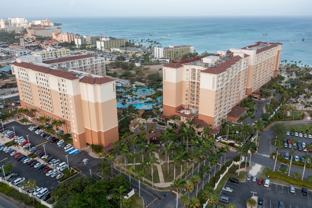 Aerial exterior of resort and ocean  