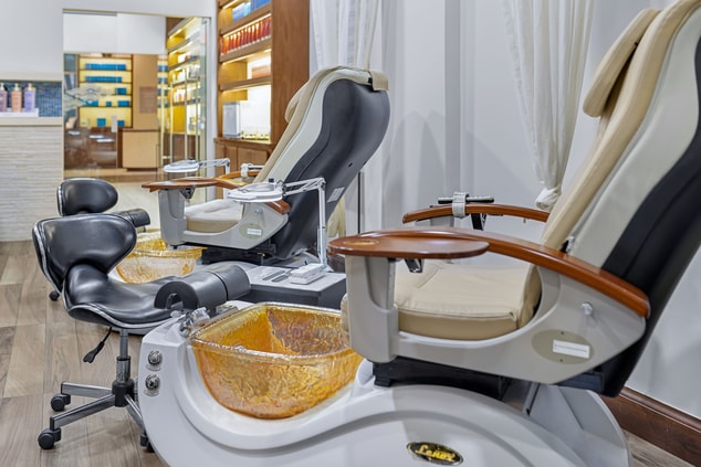 Two manicure and pedicure treatment chairs 