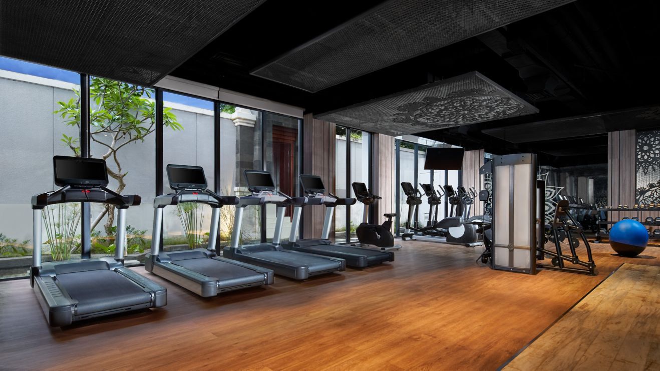 Fitness center with treadmills, bikes, weights  