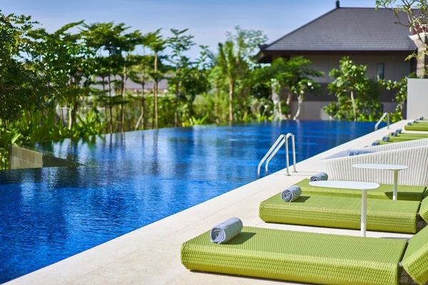 Lap pool with lounge chairs