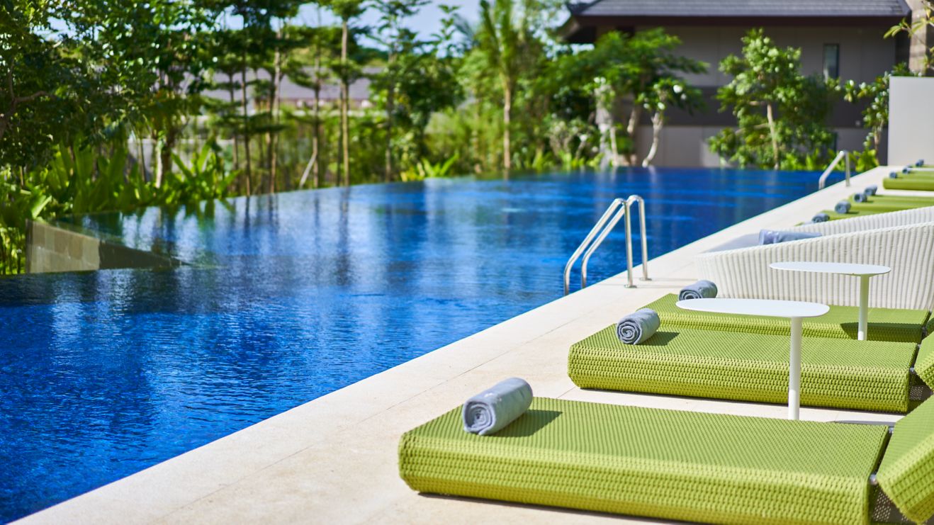 Lap pool with lounge chairs