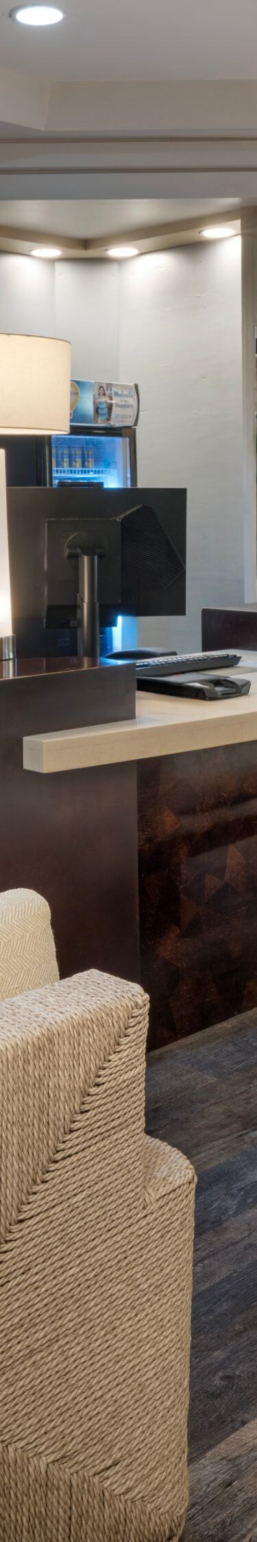 Front desk with seating and wall art
