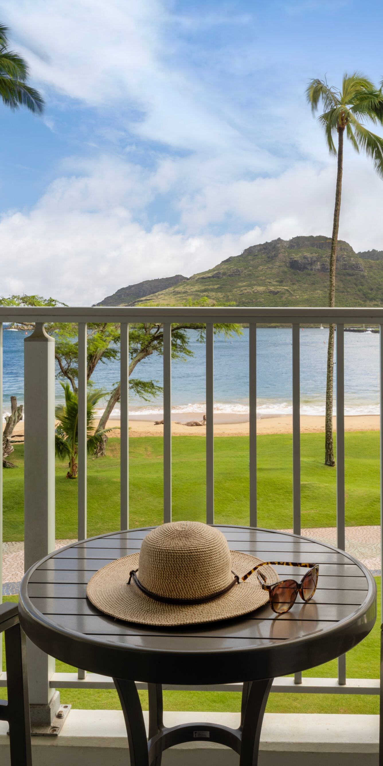 Balcony table and chairs with view of beach