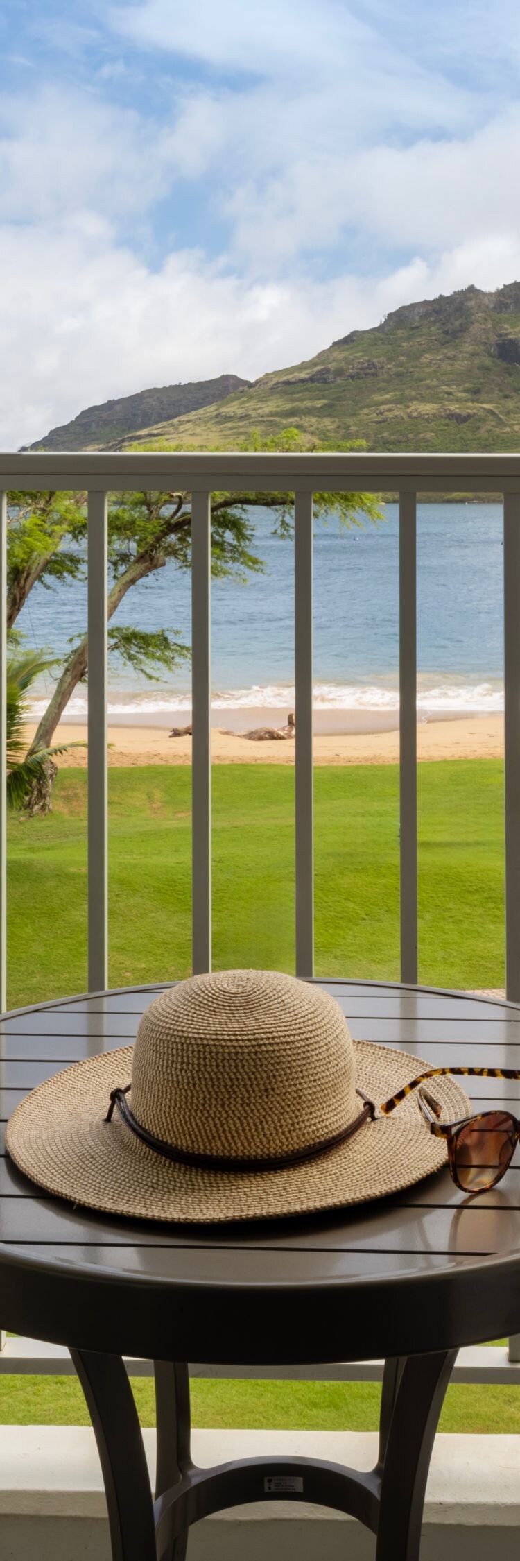 Balcony table and chairs with view of beach