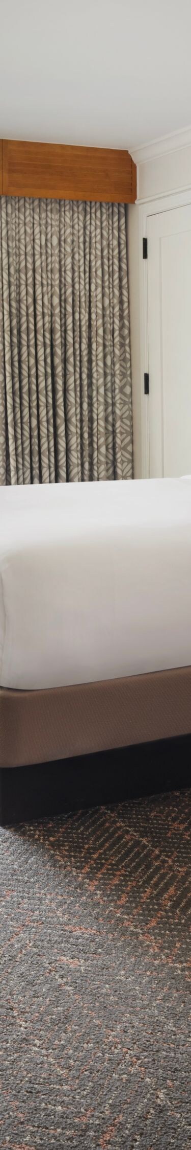 Two double beds with seating area and balcony