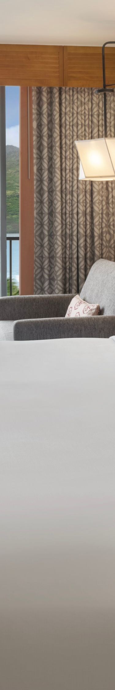 King bed with seating area and Juliet balcony