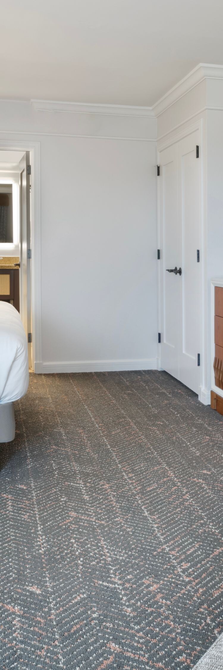 King bed with seating area, table, and TV