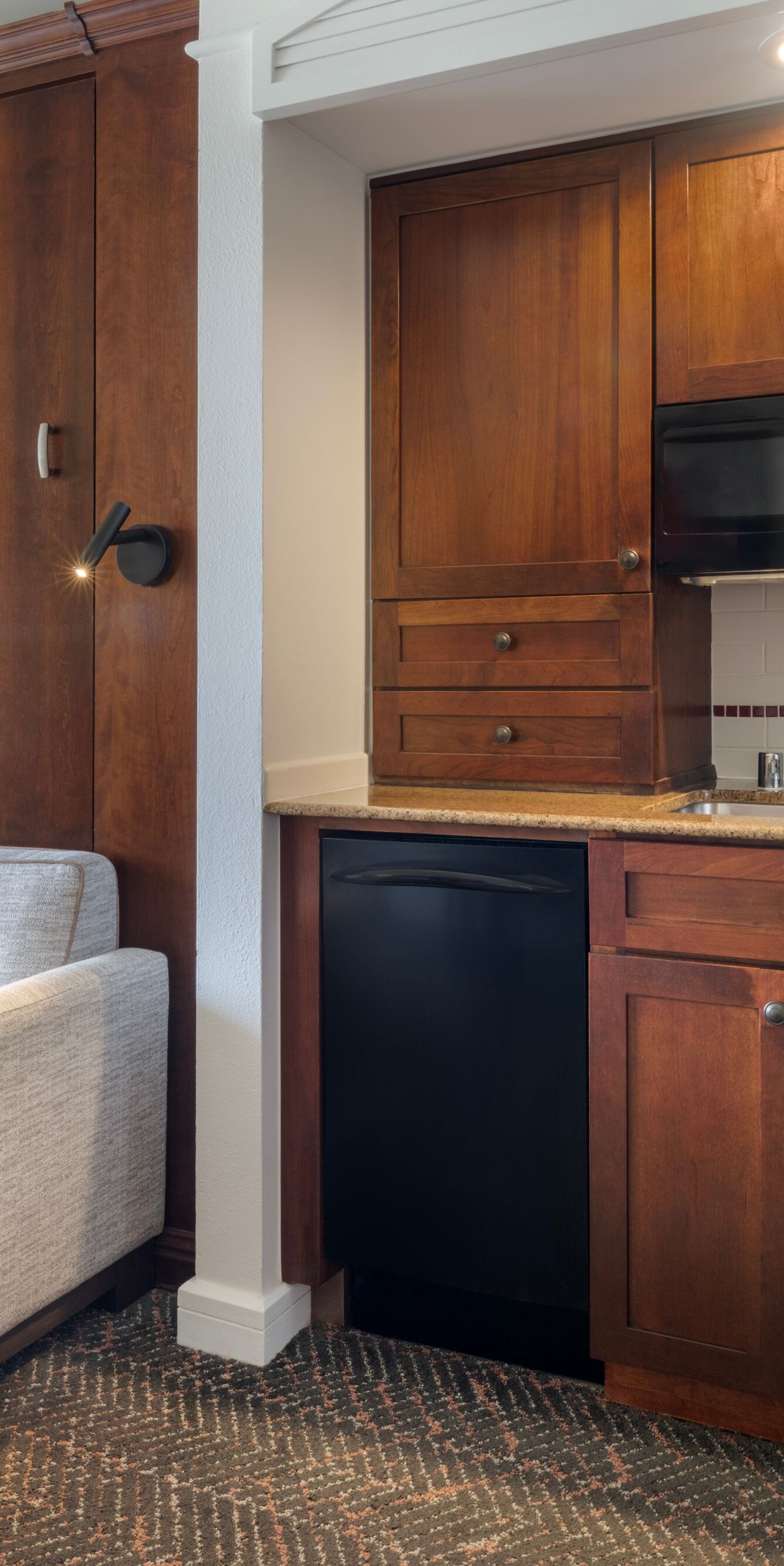 Sofa and counter with microwave, coffee maker