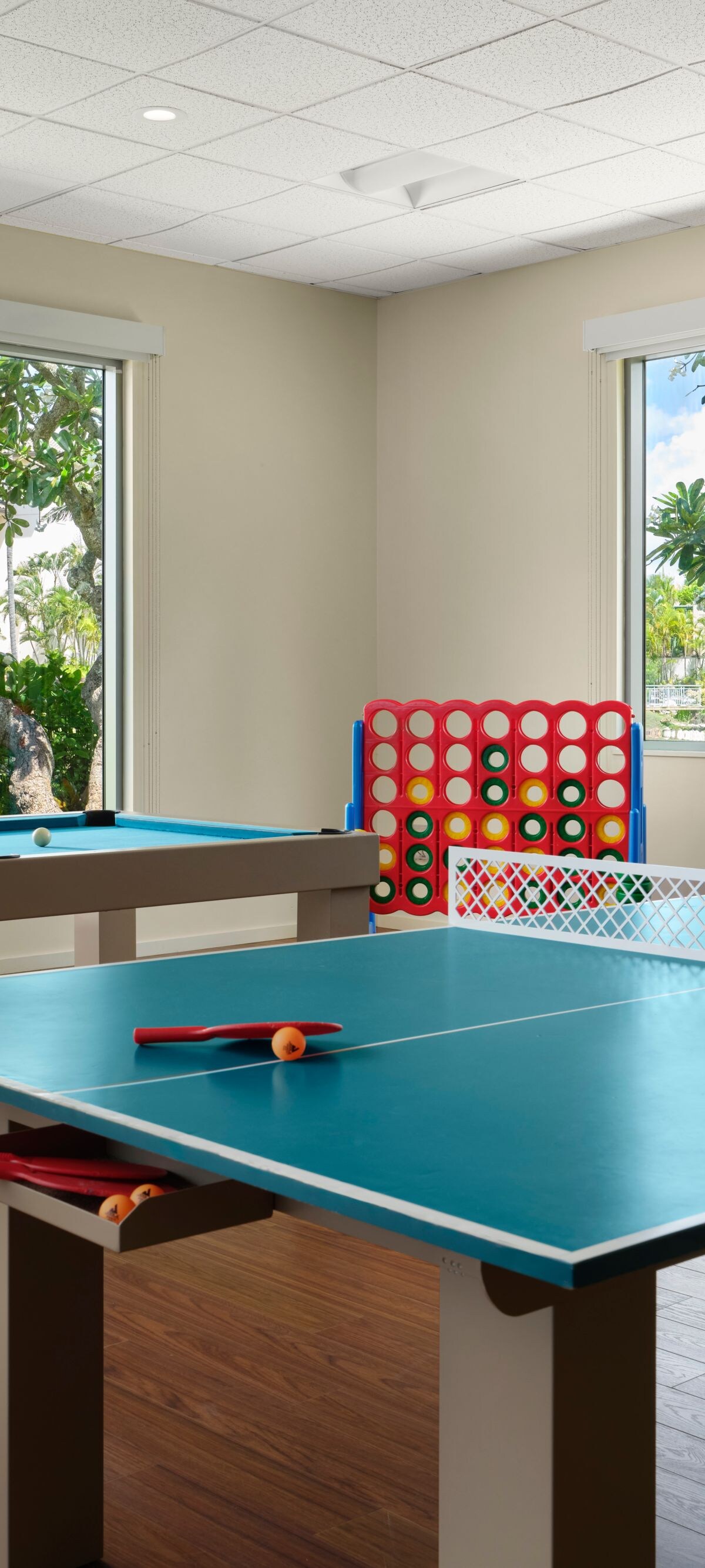Room with table tennis, billiards, and board games