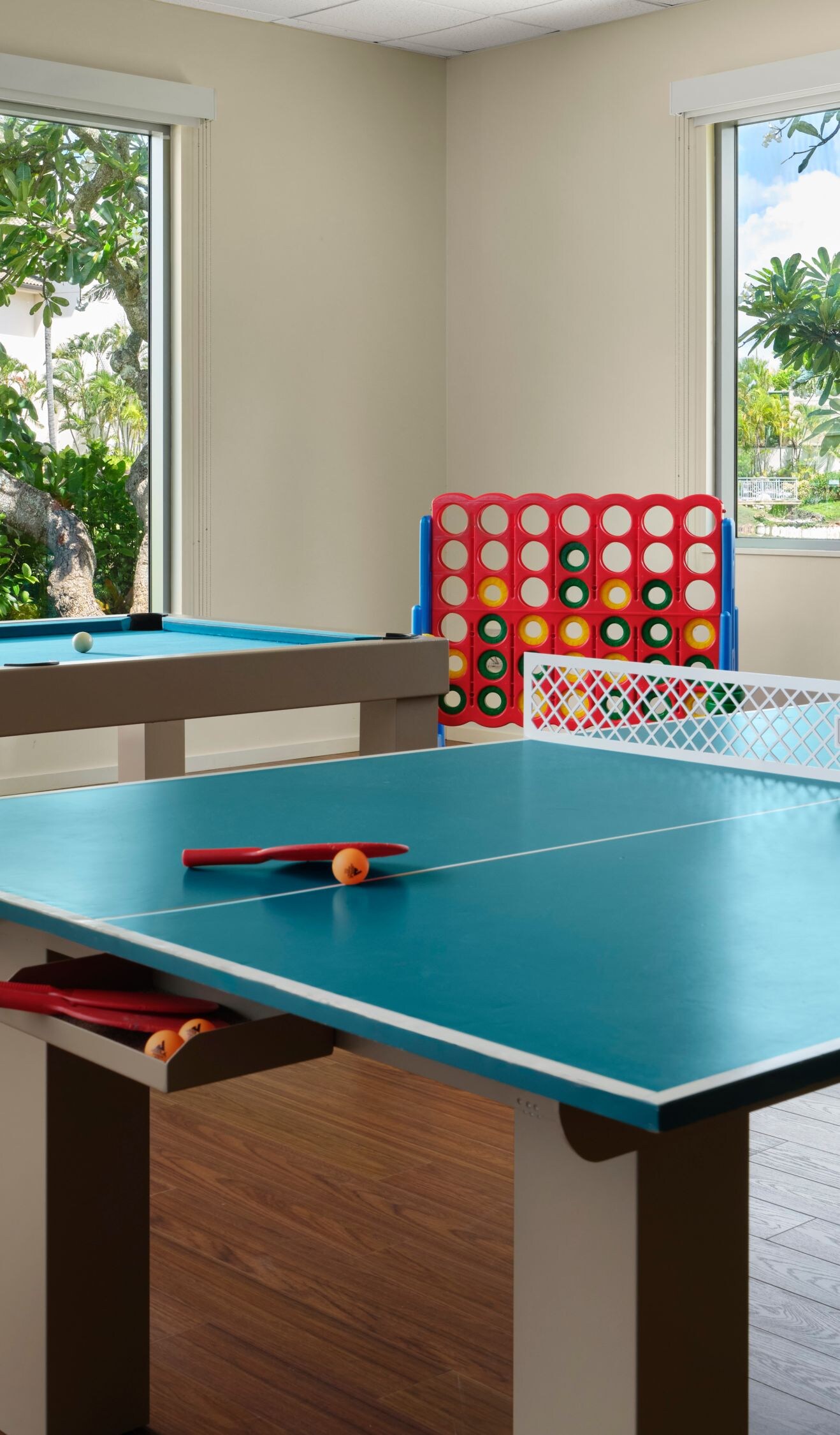 Room with table tennis, billiards, and board games