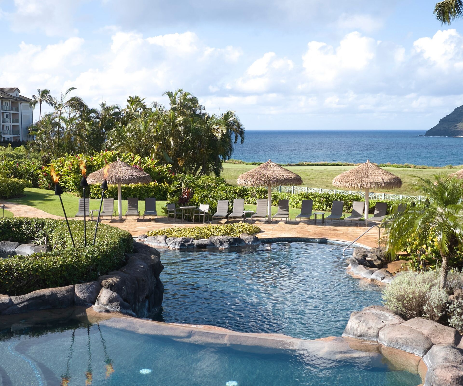 Lihue resort pool with slide and ocean views
