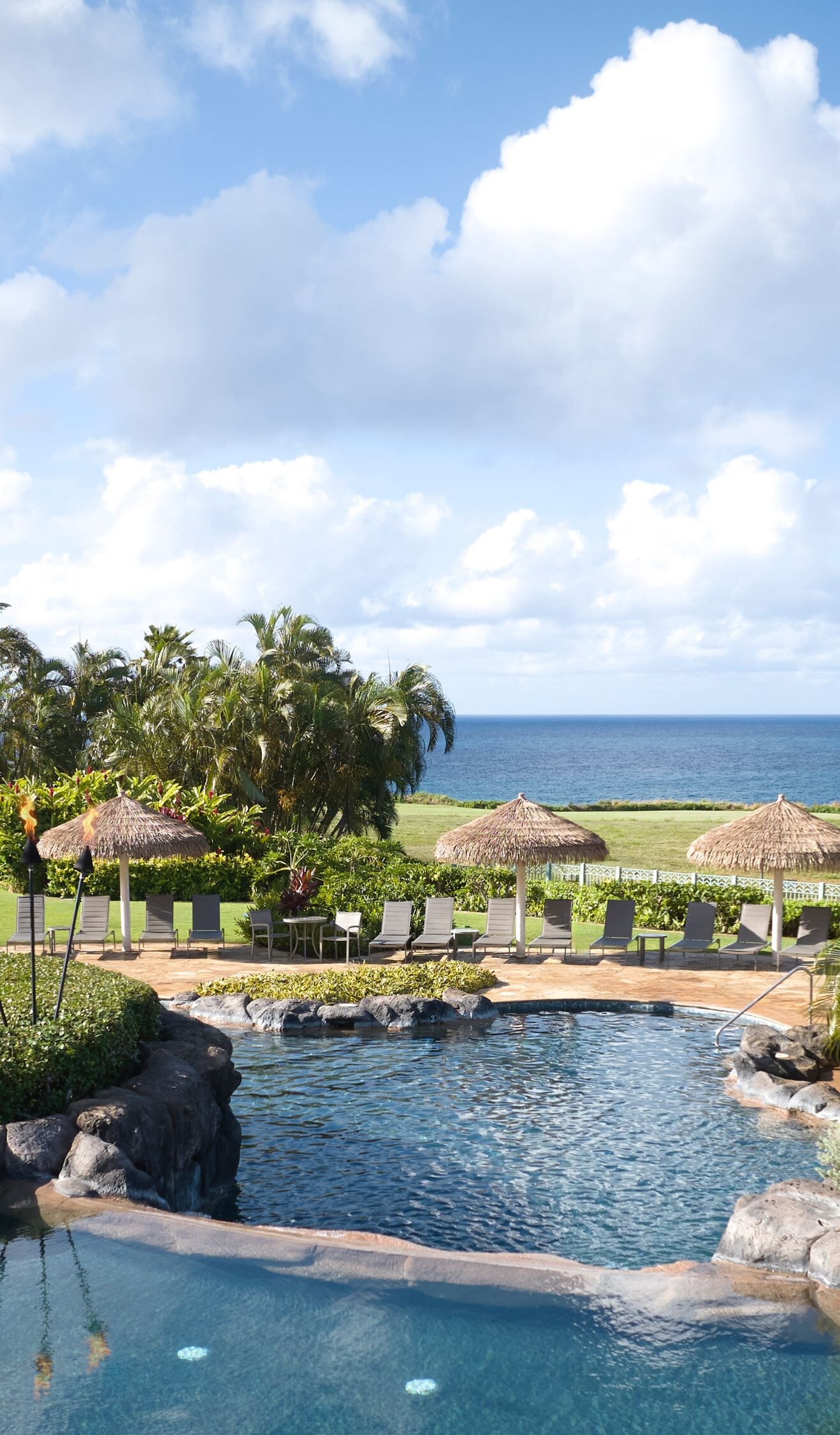 Lihue resort pool with slide and ocean views